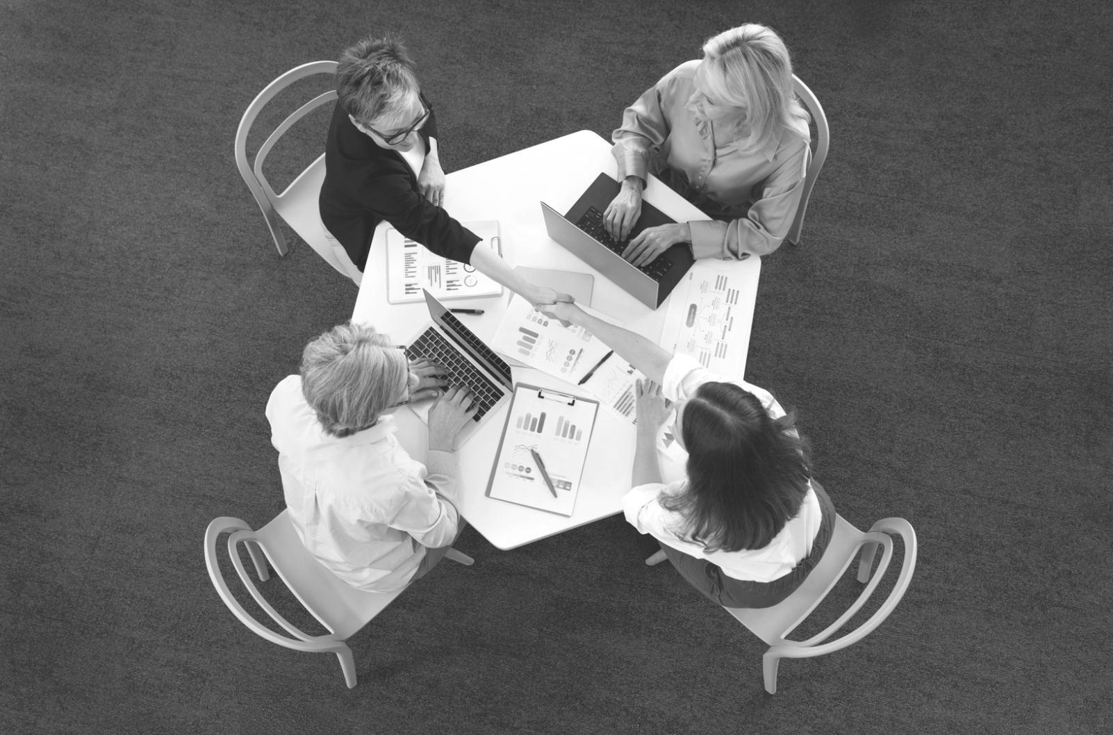 Strategic planning session with financial documents and collaboration tools
